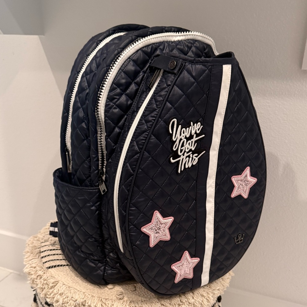 Oliver Thomas Quilted Tennis Backpack with Blue Interior.